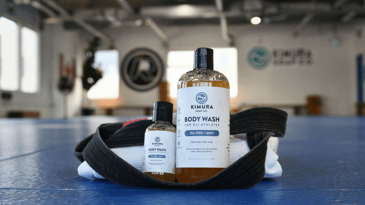 Why use tea tree oil for BJJ soap shown with a gi and gym bag